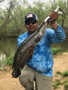 Pro Staffer Alex Perez with a good sized Northern Snakehead.