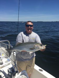 Mike Fiore holds up a nice Rockfish caught yesterday while jigging with light tackle.